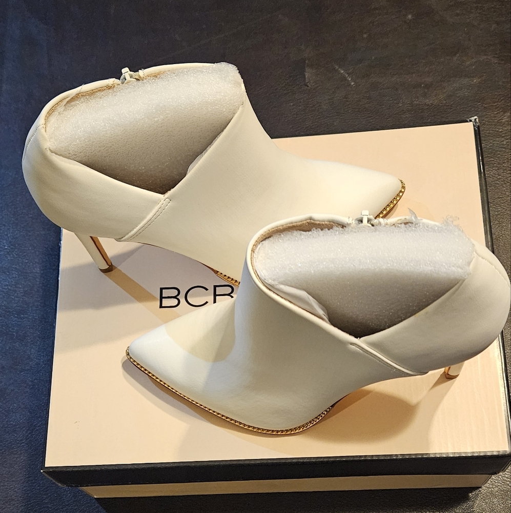 BCBG bright white ankle boots. Size 7.5 with a 3.75 inch heel. New in box.